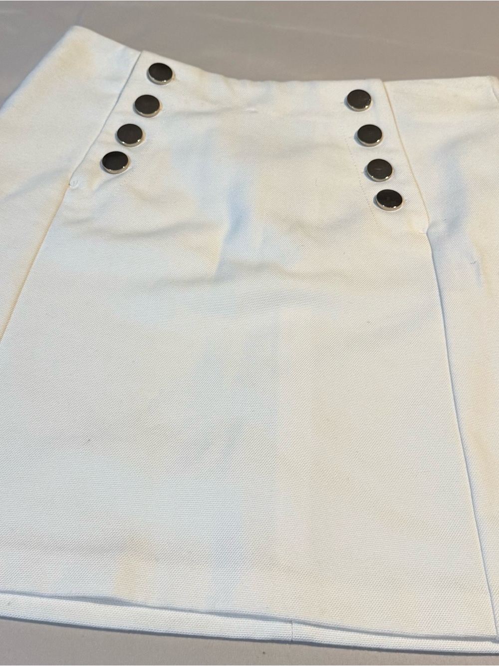 H&M White Mini Skirt with Black Button Detail